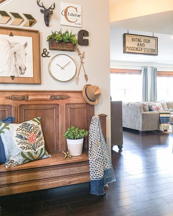 Eclectic home tour of Louisa Craven - love the warm wood bench and old sign kellyelko.com