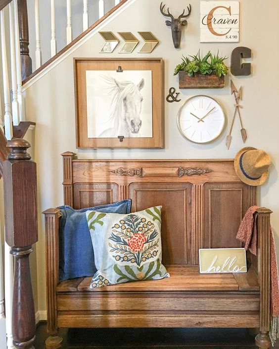 Love this bench that looks like an old church pew and the gallery wall above kellyelko.com