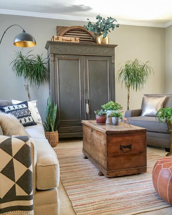 A black armoire is the focal point in this cozy living room kellyelko.com