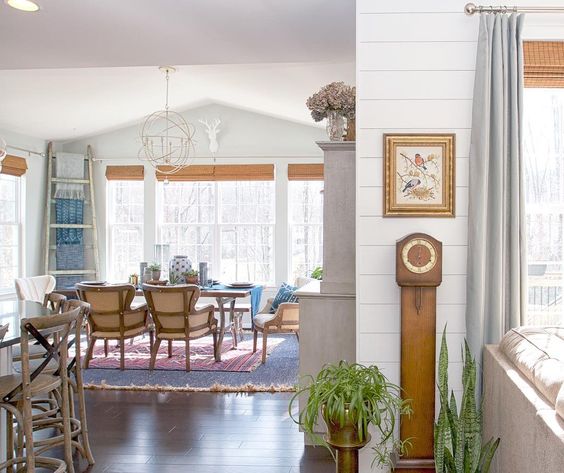 Kitchen breakfast nook with high ceilings and statement chandelier kellyelko.com