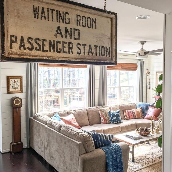 An old sign adds personality to this cozy family room kellyelko.com