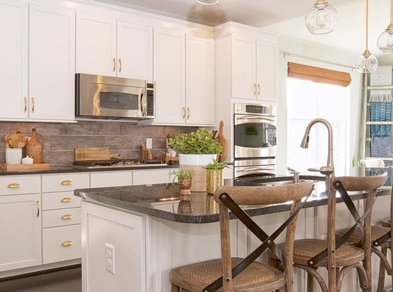 White kitchen with black counters and warm wood bar stools kellyelko.com