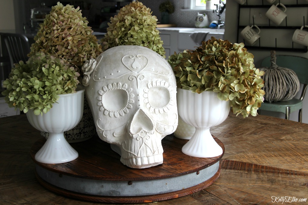 Love this sugar skull surrounded by dried hydrangeas for a quick and unique centerpiece kellyelko.com