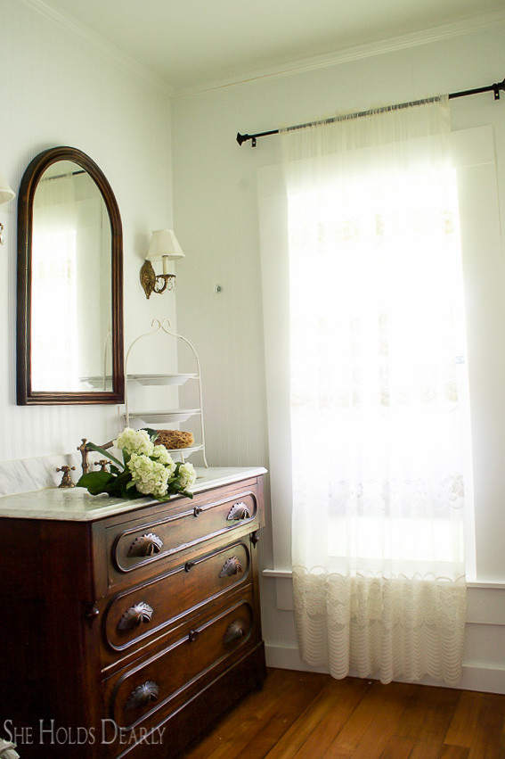 Farmhouse tour - love the antique dresser turned bathroom vanity