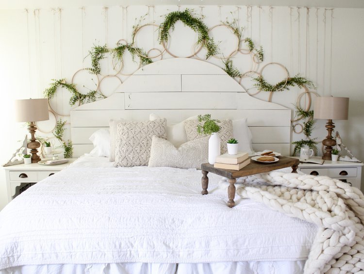 Farmhouse tour - love this wall of embroidery hoop wreaths over the bed