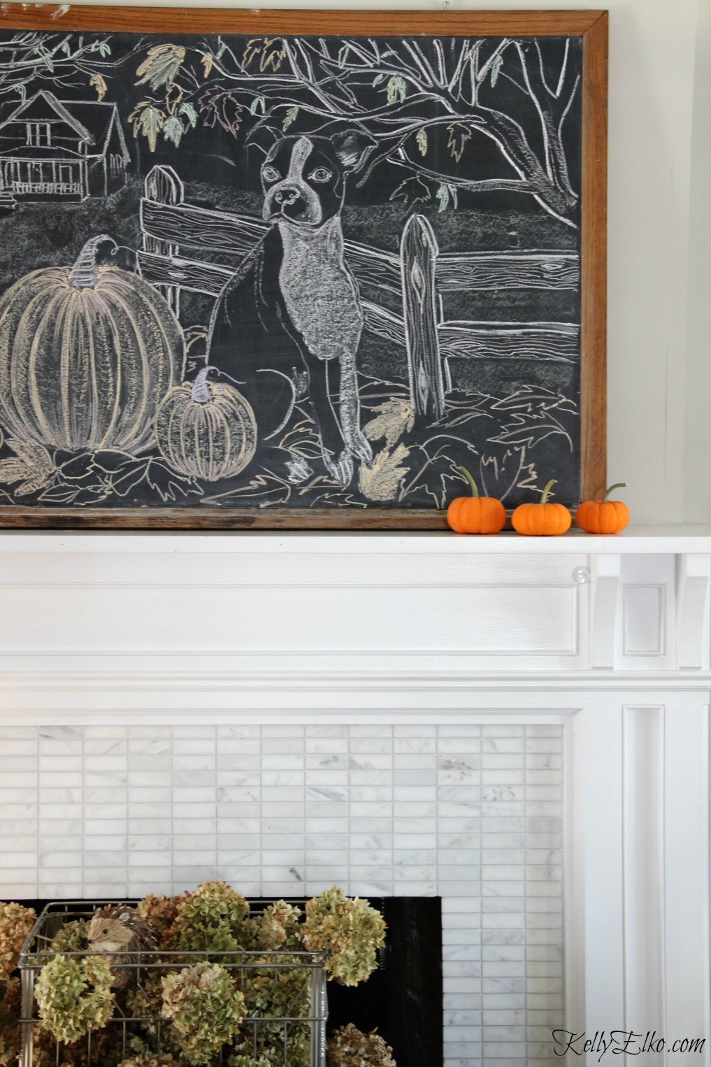 Love this fall chalkboard art mantel in this eclectic fall living room kellyelko.com