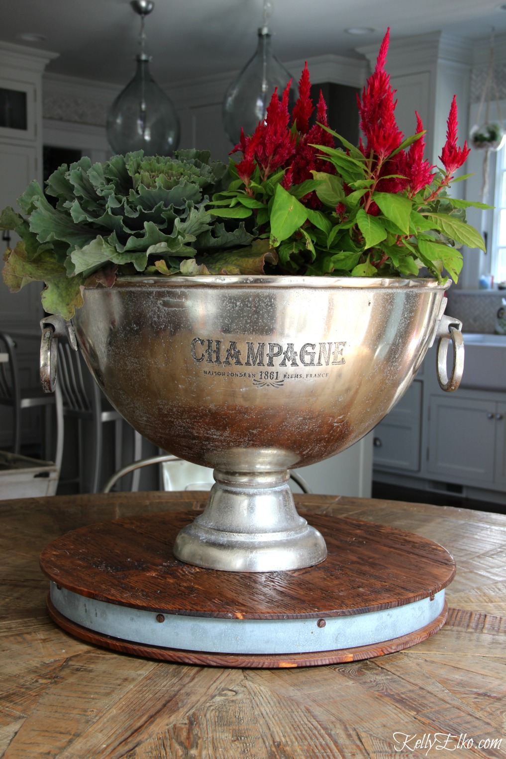 Get creative with your planters - this champagne bucket makes a fun fall planter kellyelko.com