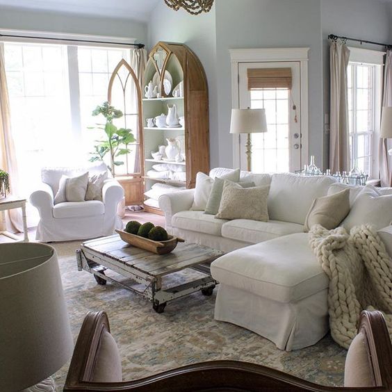 Farmhouse tour - love this neutral family room with white sofa and antique furniture