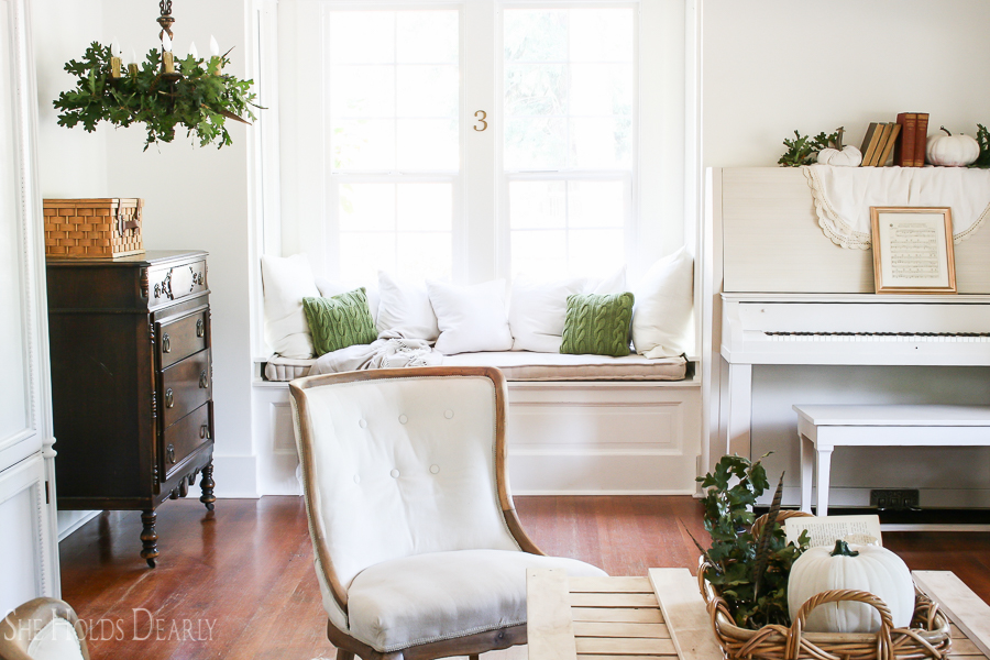 Farmhouse tour - love the cozy window seat in the living room 