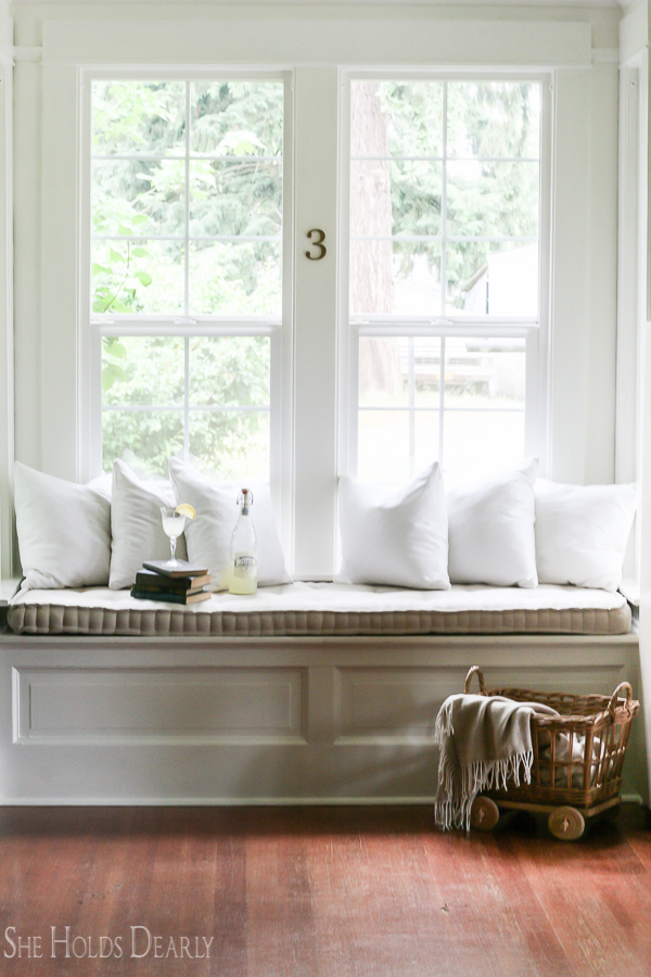 Farmhouse tour - love the cozy upholstered window seat