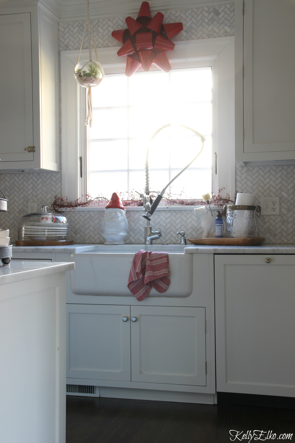 Christmas Kitchen - love the big red metal bowl over the window kellyelko.com