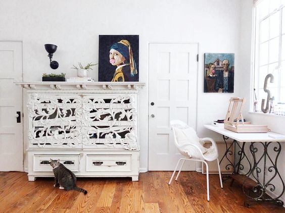 Love this home office and the unique carved cabinet