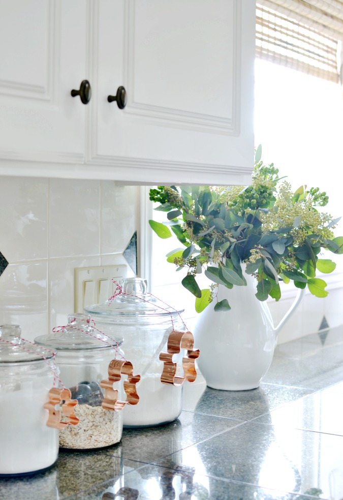 Creative Christmas Decorating Ideas - love the simplicity of tying cookie cutters to jars in the kitchen