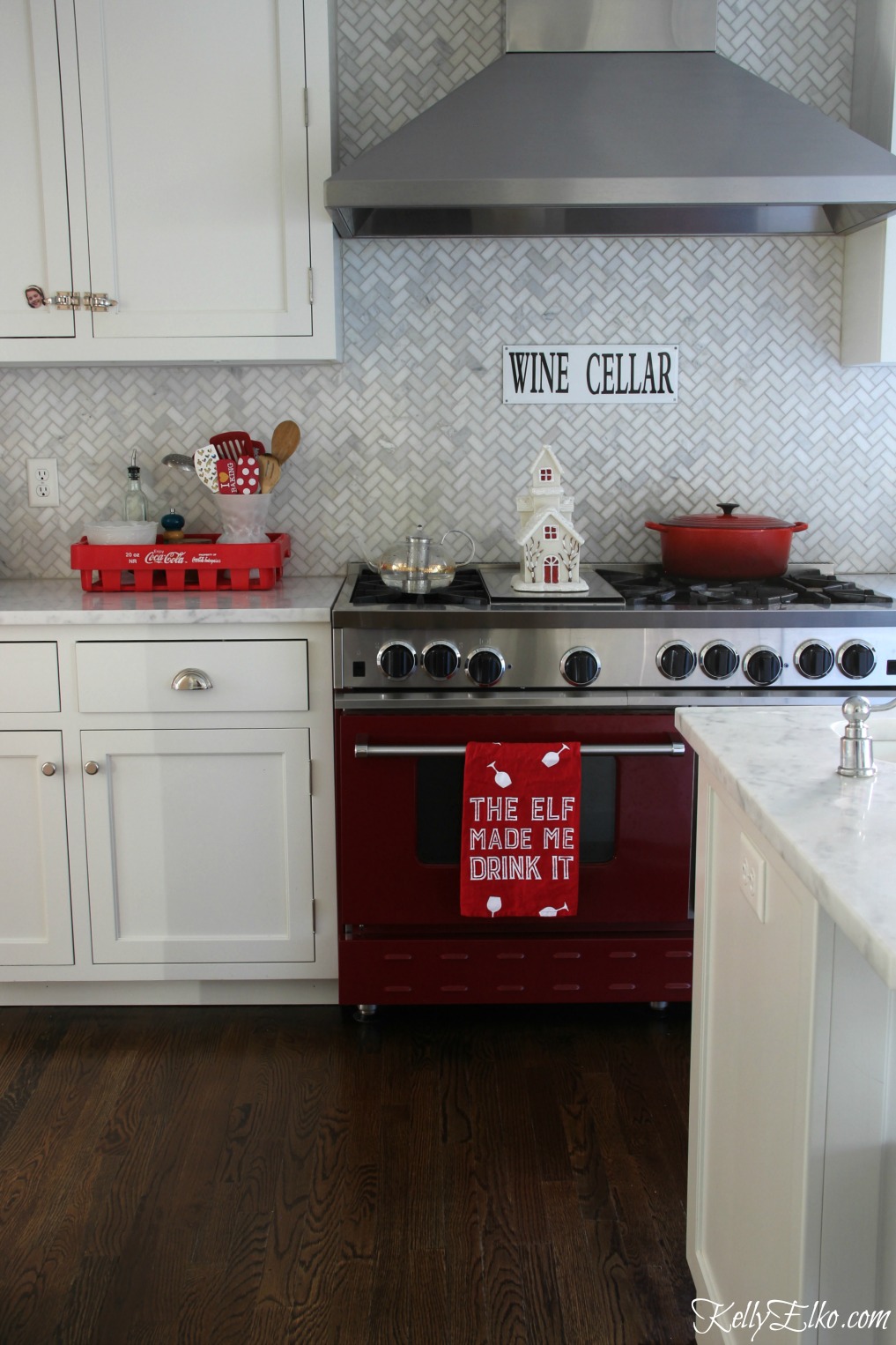 Christmas Kitchen - love the red stove and touches of red for a festive look kellyelko.com