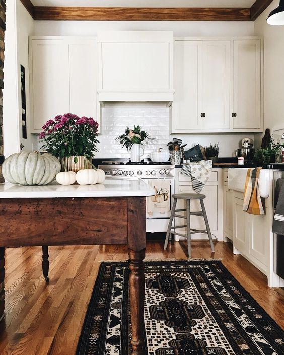 Farmhouse Tour - love this classic white kitchen with wood table island 