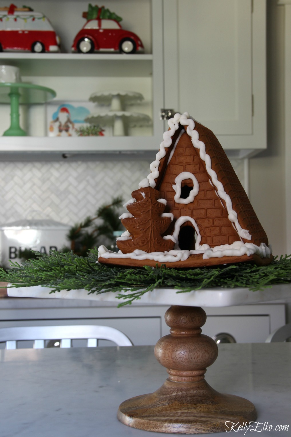 Christmas Kitchen - love the cute little gingerbread house on a cake stand kellyelko.com