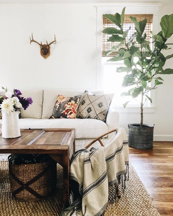 Farmhouse Tour - love this cozy sofa and old door turned coffee table