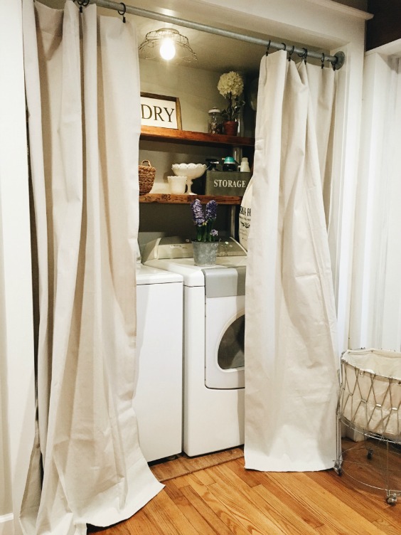 Farmhouse Tour - closet laundry room with curtains