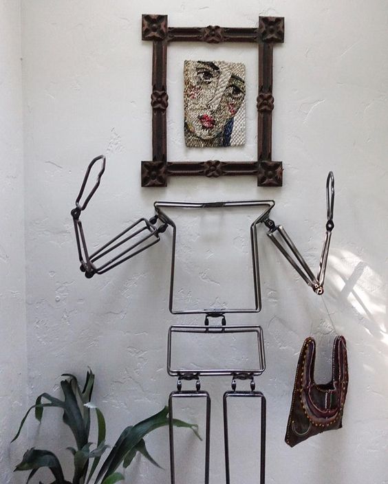 How fun - and iron body form with framed art as the head 