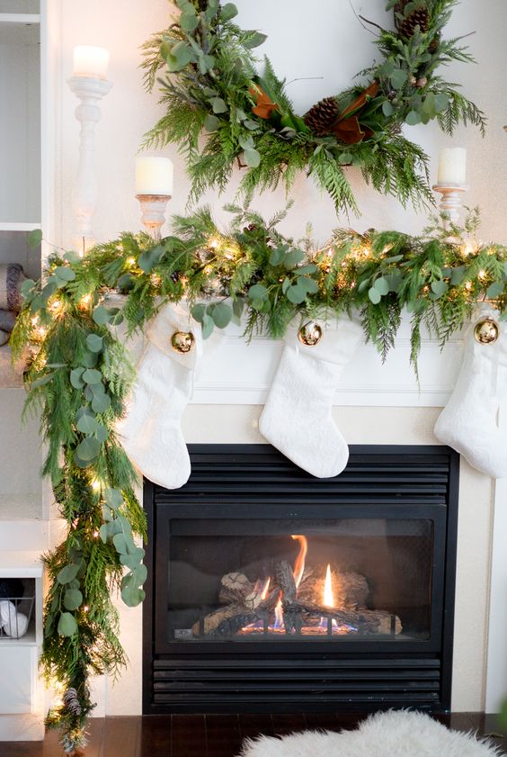 Creative Christmas Decorating Ideas - love this gorgeous real garland and white stockings 