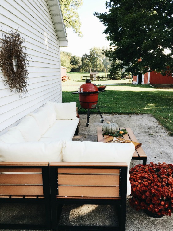 Farmhouse Tour - love this patio with sectional sofa and of course that red barn!