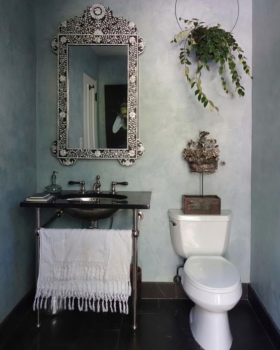 Powder room with chrome leg sink and bone inlay mirror