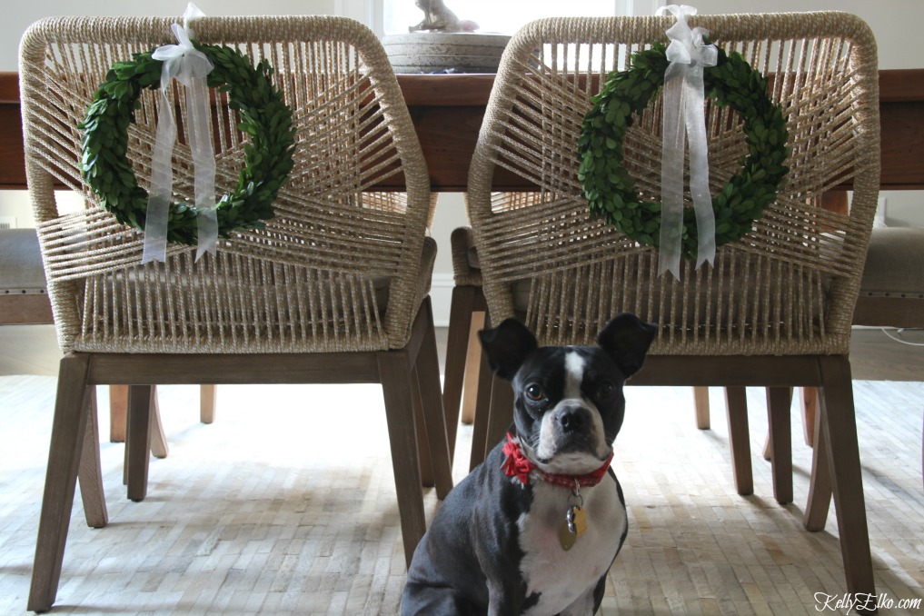 Preserved boxwood wreaths on chair backs kellyelko.com