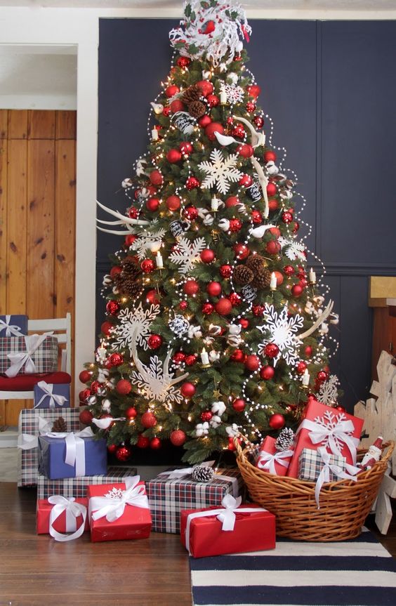 Creative Christmas Decorating Ideas - love this Christmas tree with snowflakes tucked into the branches