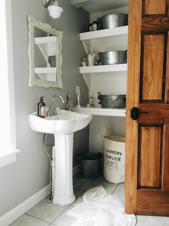 Farmhouse Tour - love this simple white bathroom with open shelves