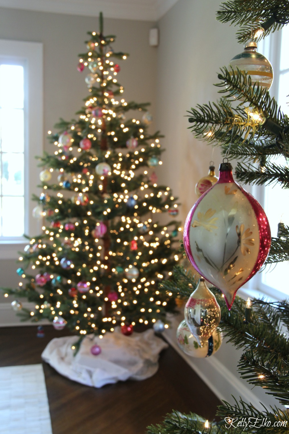 Sparse branches of this faux fir Christmas tree is perfect for showing off ornaments kellyelko.com