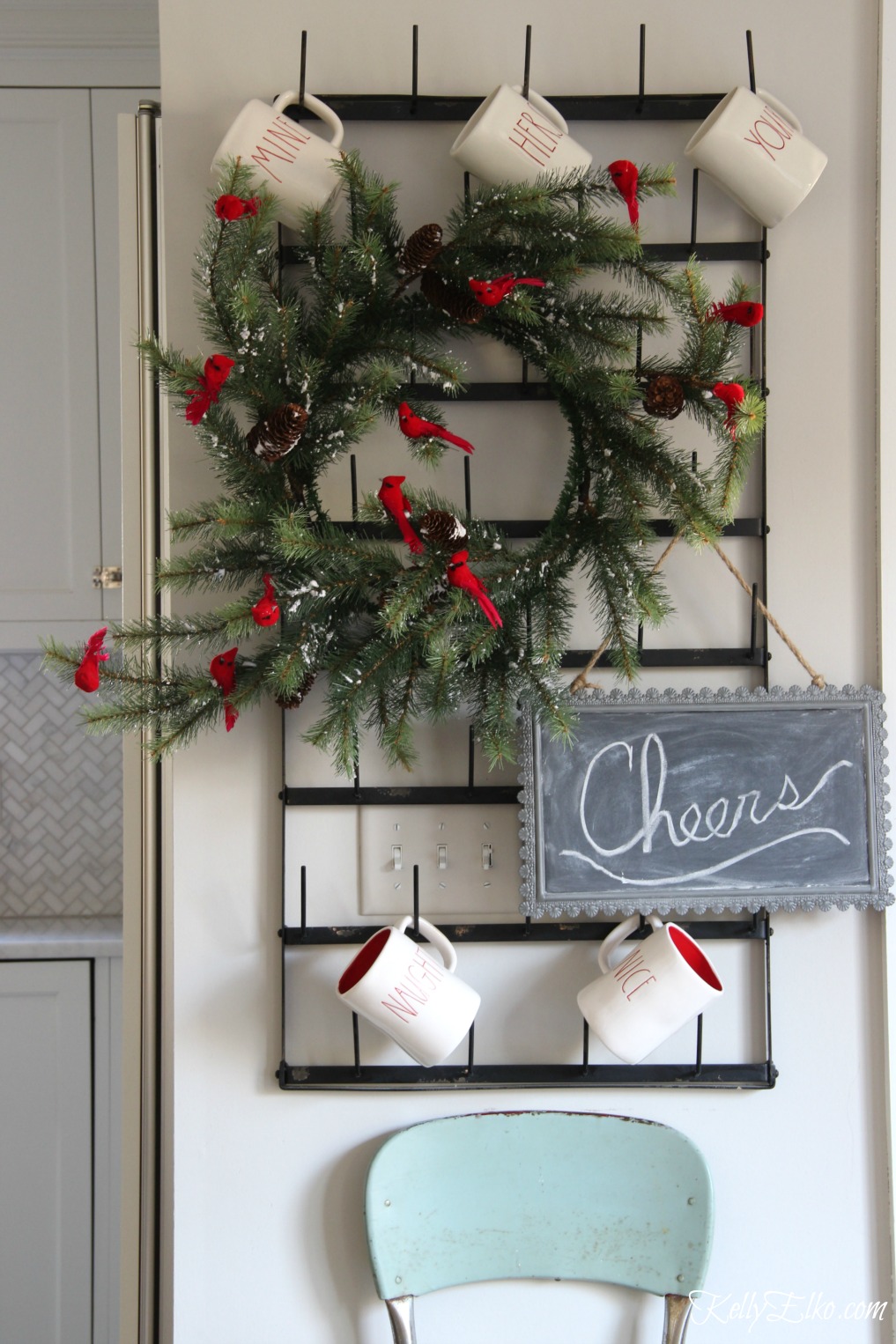 Christmas Kitchen - love this wall mounted bottle drying rack for displaying mugs and a festive wreath kellyelko.com