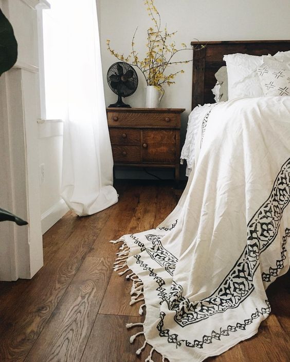 Farmhouse Tour - love the white bedding against dark wood headboard and floors