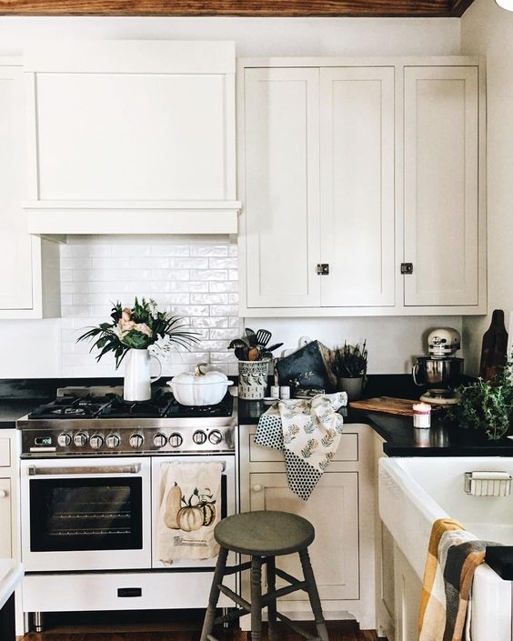 Farmhouse Tour - love this classic white kitchen with white stove and subway tile