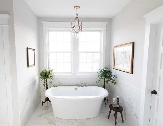 Eclectic Home Tour of Green Spruce Designs - love the marble bathtub surround 