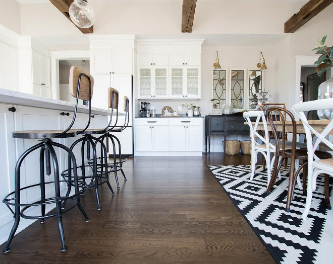 Eclectic Home Tour of Green Spruce Designs - love the antique wood beams in the white kitchen