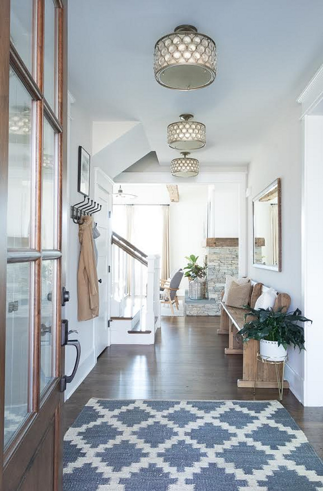 Eclectic Home Tour - this stunning new build is a perfect mix of new and old and I love the old church pew in the foyer kellyelko.com