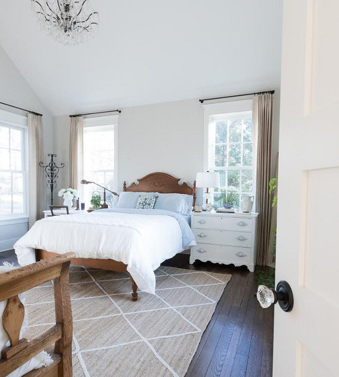 Eclectic Home Tour of Green Spruce Designs - neutral bedroom with crystal chandelier and painted bedside tables