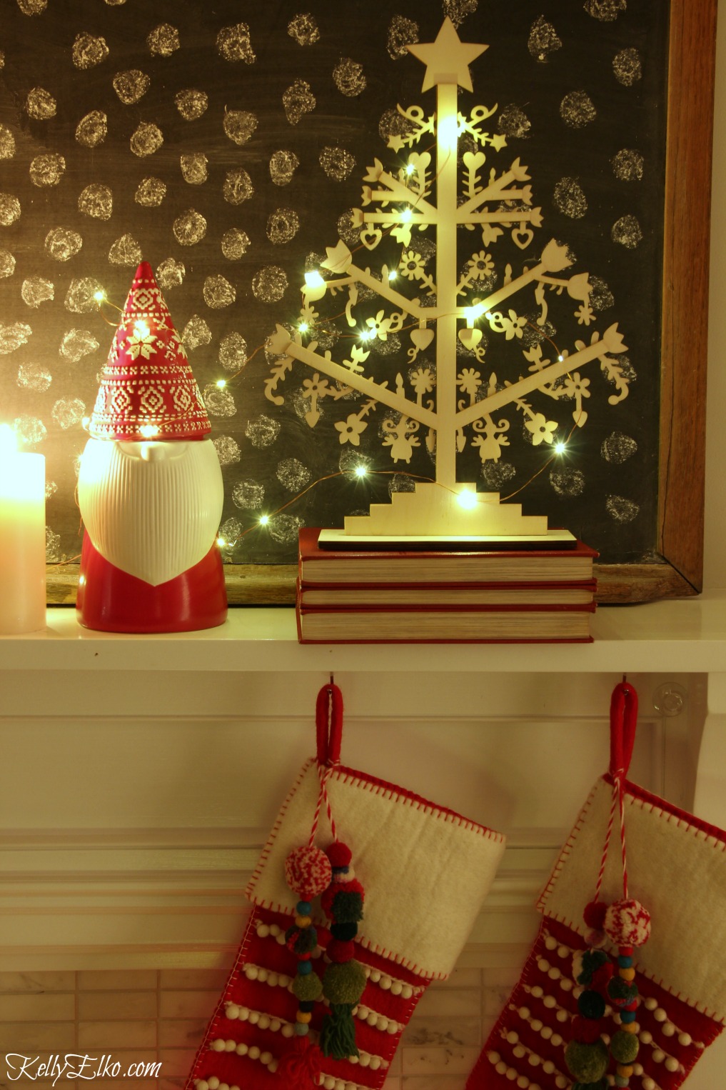 Christmas Nights Tour - see 25 of the best Christmas homes lit up at night! Love this cute little gnome and pom pom stockings kellyelko.com #christmas #christmasdecorating #christmasdecor #christmaslights