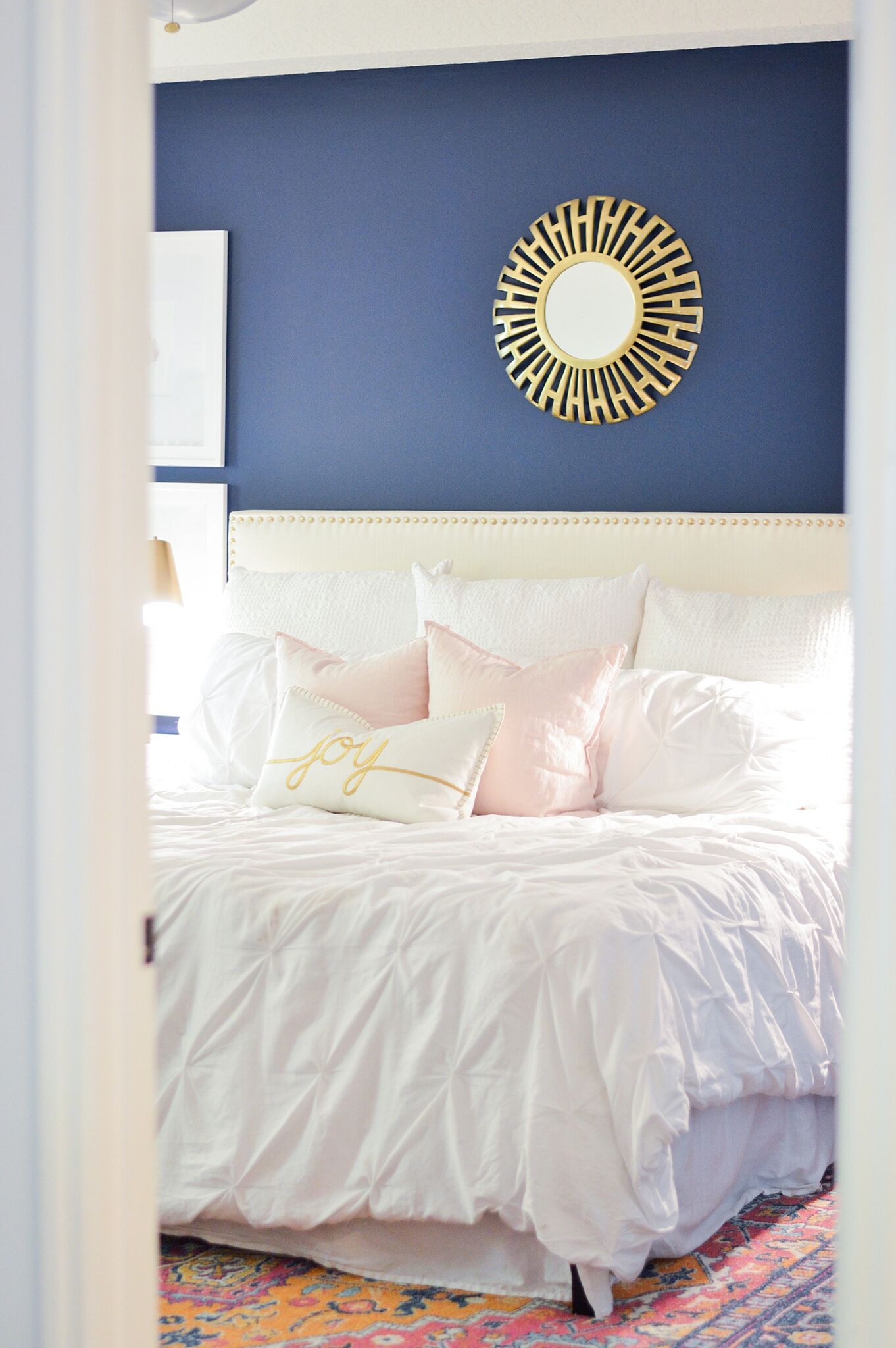 Christmas Eclectic Home Tour - love the navy blue paint in this master bedroom