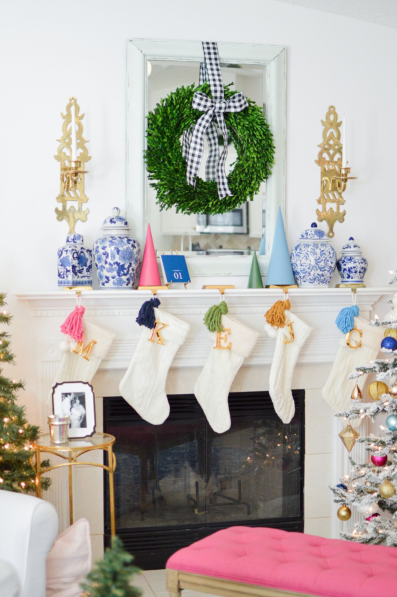 Christmas Eclectic Home Tour - love the colorful DIY tassels on the white stockings 