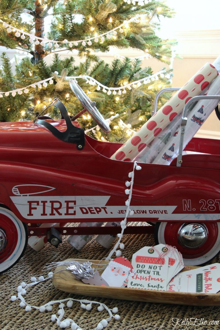 Christmas Details - love this red fire truck filled with wrapping paper kellyelko.com