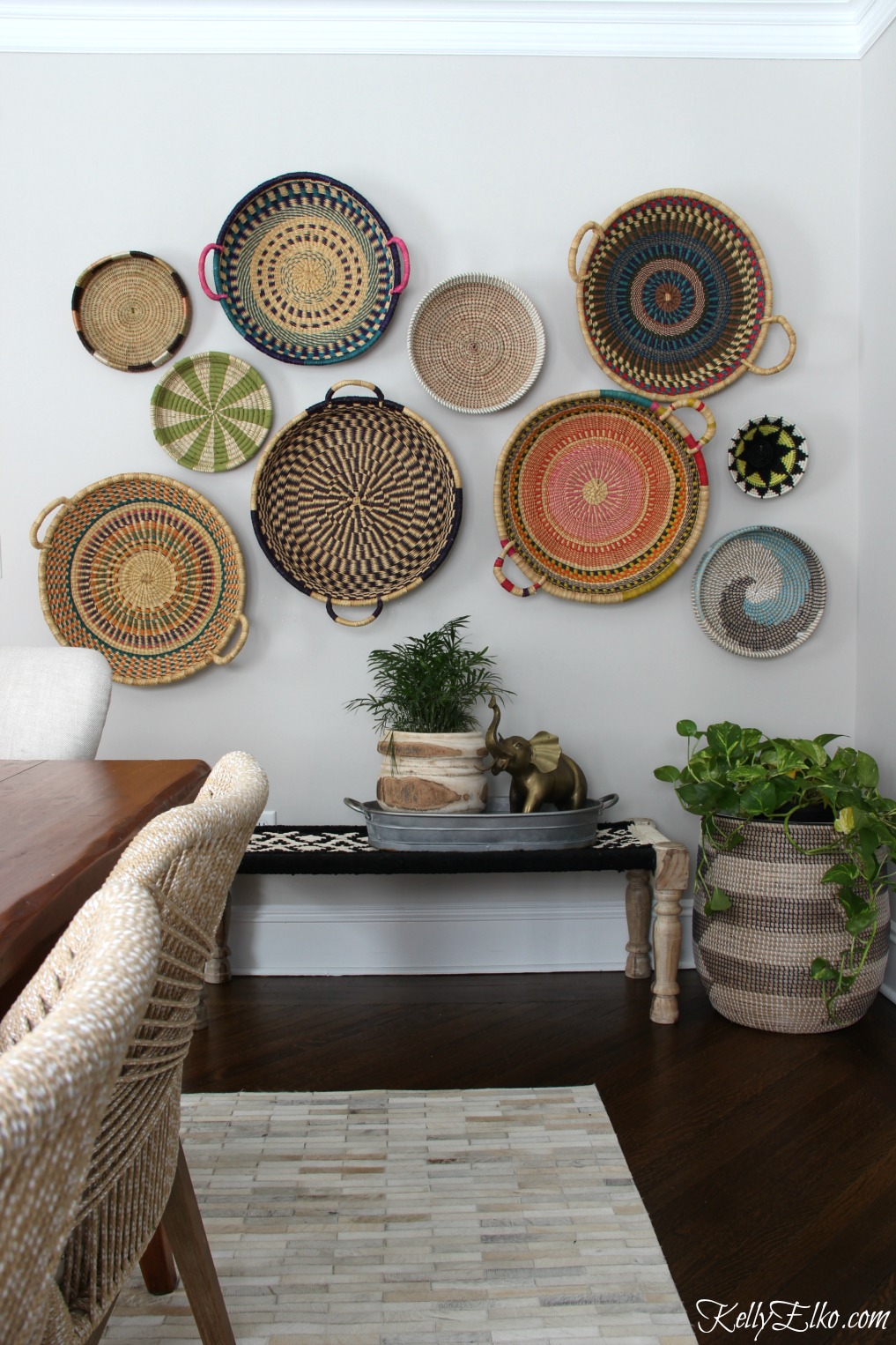 Basket Gallery Wall - love this colorful, eclectic, hand woven African basket wall and her unique way to hang them! kellyelko.com #basket #basketwall #gallerywall #bohodecor #bohemiandecor #eclecticdecor #vintagedecor #colorfuldecor #walldecor #diydecor 