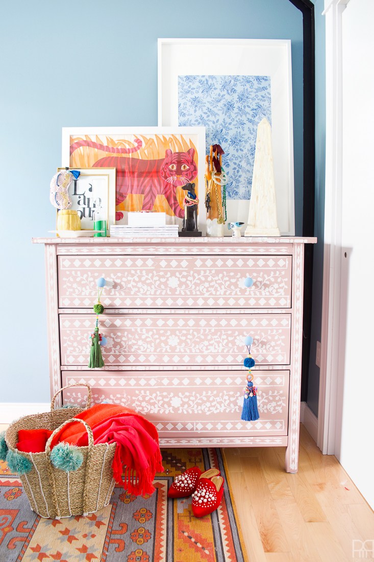 Eclectic Home Tour of PMQ for Two - get tons of renter friendly decorating and DIY ideas like this stenciled dresser that looks like inlaid bone