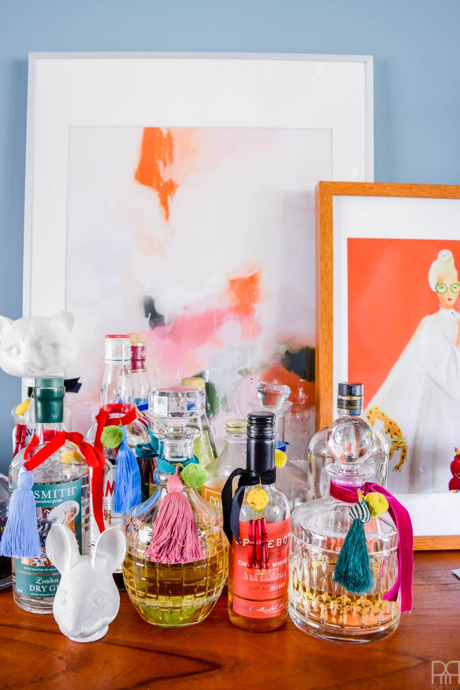 Eclectic Home Tour of PMQ for Two - get tons of renter friendly decorating and DIY ideas - love these DIY tassels for liquor bottles