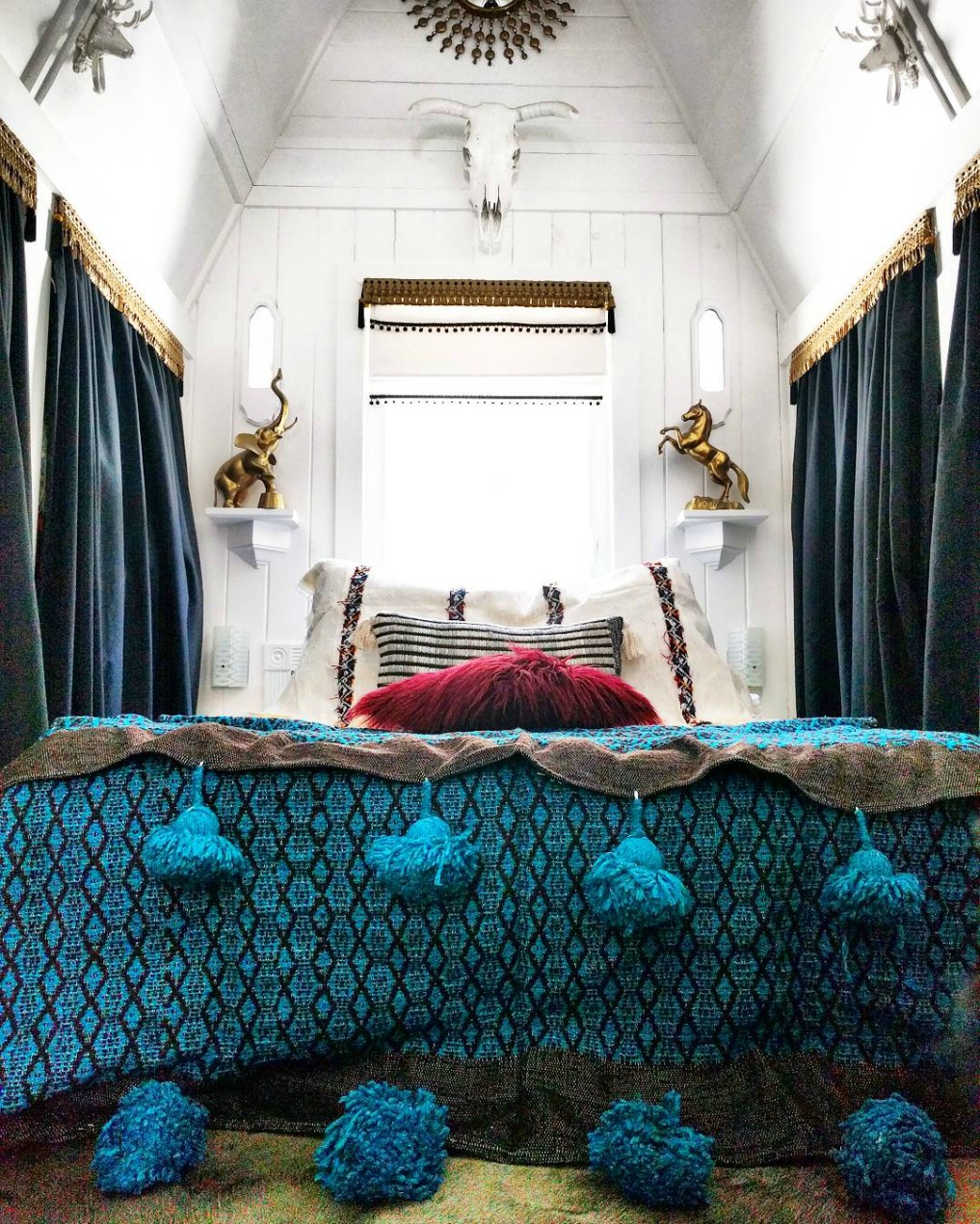 Eclectic Home Tour - Insieme House - tour this tiny house and this cozy master bedroom with clever storage solutions