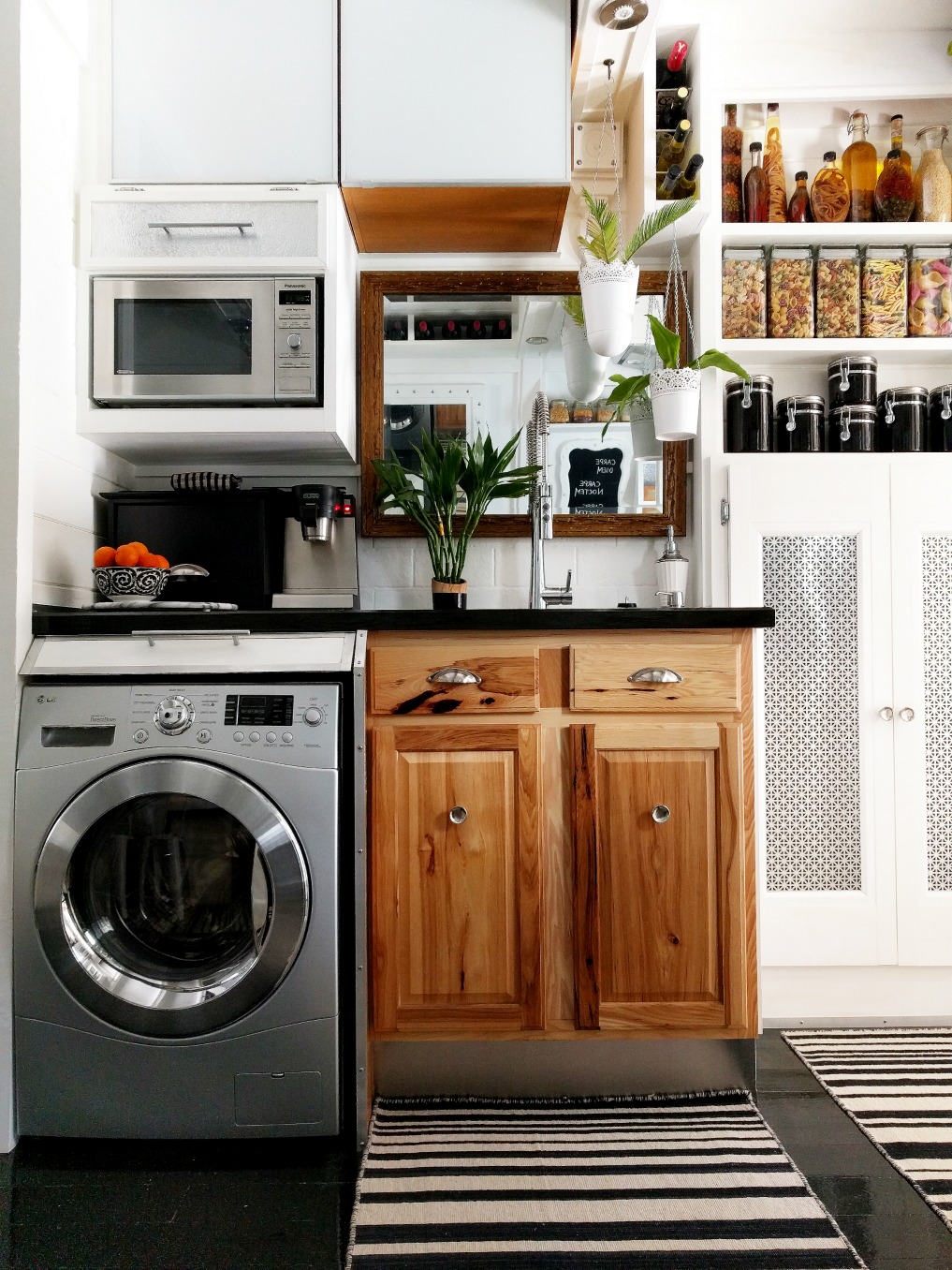 Eclectic Home Tour - Insieme House - tour this tiny house with a combined kitchen and laundry room with lots of clever storage