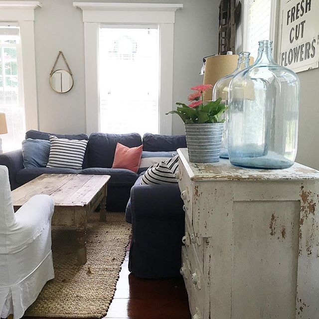 Eclectic Home Tour of Liv and Grace Restored - love this cozy family room with blue sectional sofa and chippy vintage furniture kellyelko.com