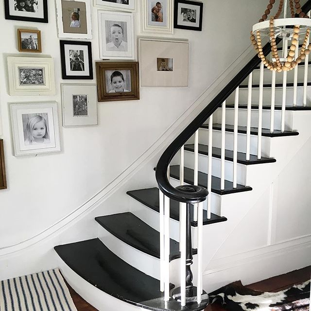 Eclectic Home Tour of Liv and Grace Restored - love the family photo gallery wall on the staircase in this antique home kellyelko.com