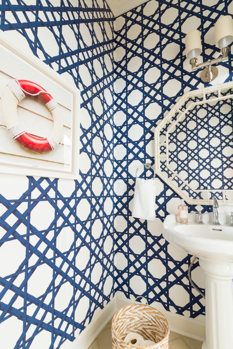 Eclectic Home Tour - love the blue trellis wallpaper in this powder room and the coastal art #wallpaper #powderroom #bathroomdecor 