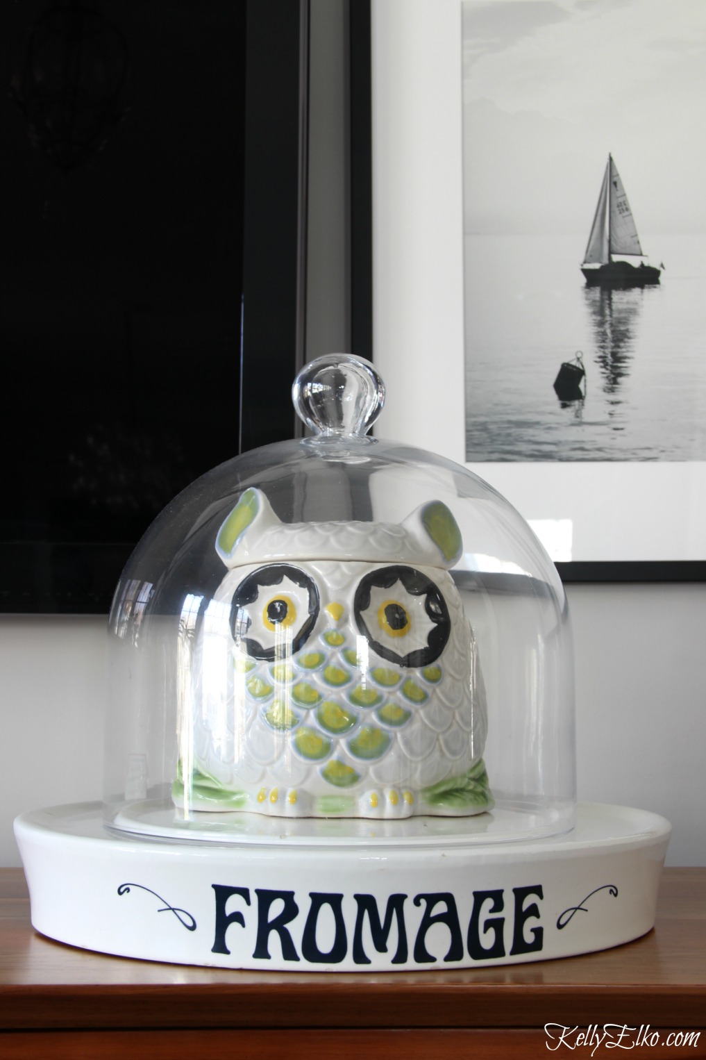 Love this family room and her fun accessories including an owl cookie jar under a cloche kellyelko.com #owl #homedecor #homeaccessories 